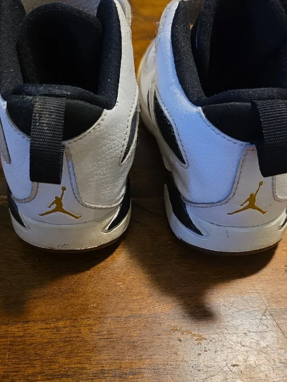 Jordan Kids' White and Black High-Top Sneakers with Gold Jumpman